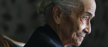 A close up of an elderly woman’s face in profile.