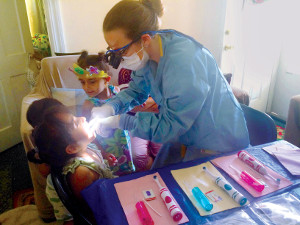 A child receiving an at-home dental exam