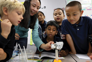 A group of elementary school students conducting a science experiment