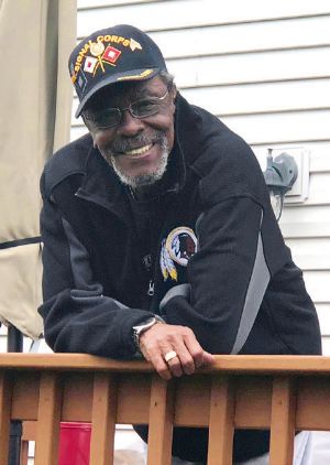 A smiling Jimmy Dorsey wearing a cap that reads \