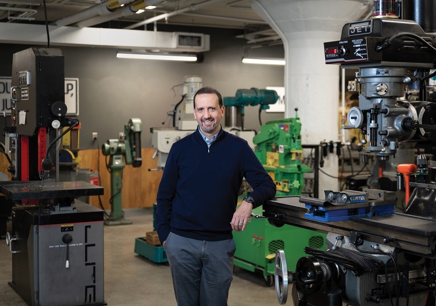 Photo of Michael Goldberg standing in an industrial shop.