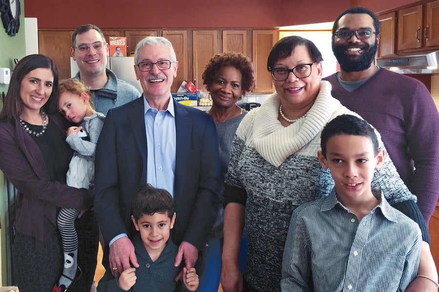 Photo of Mahmoud Ghannoum and Elaine Dorsey surrounded by members of their families