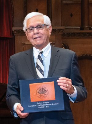 Image of Frank Linsalata holding a photobook