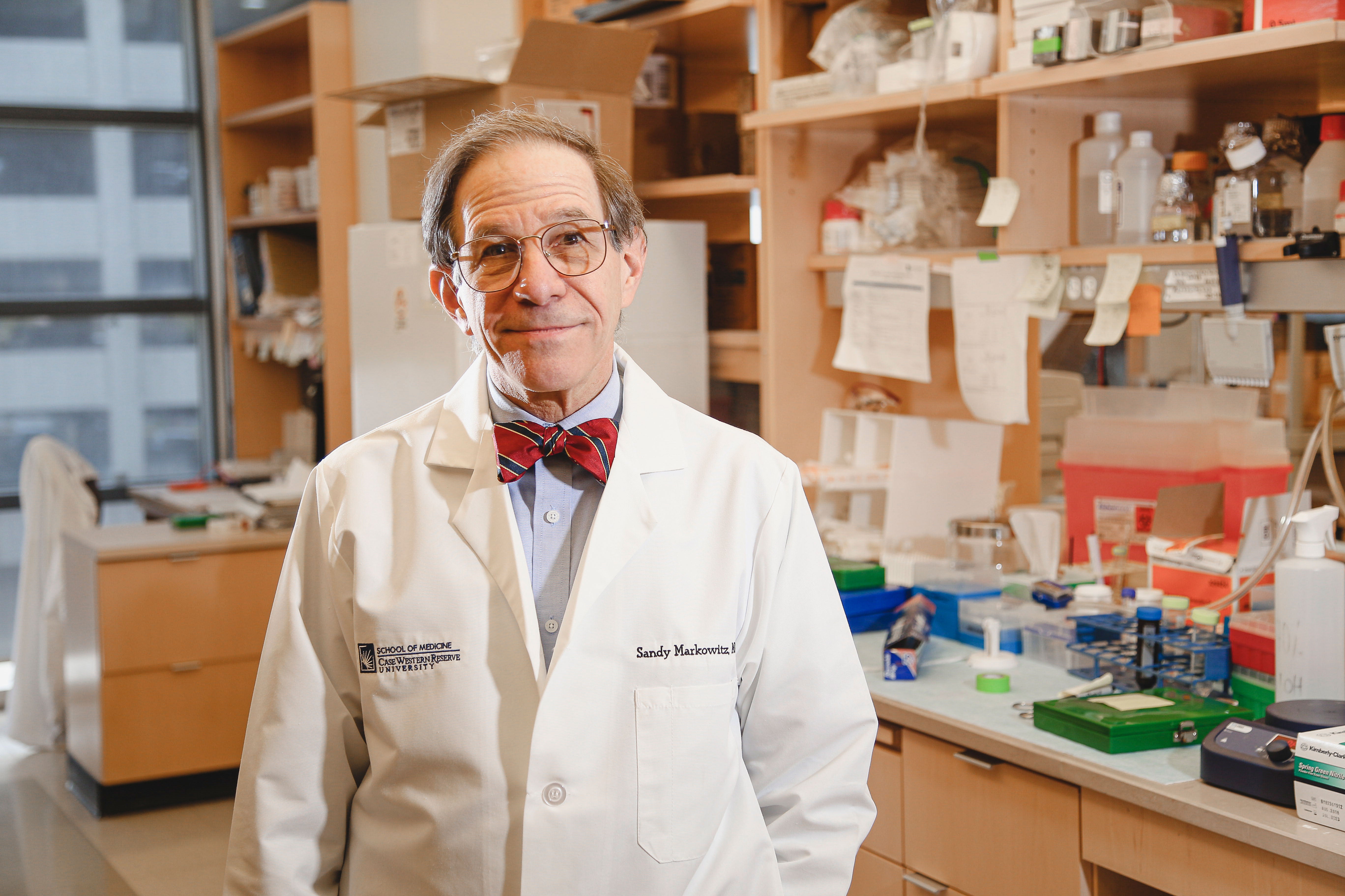 Photo of Sanford “Sandy” Markowitz in a lab