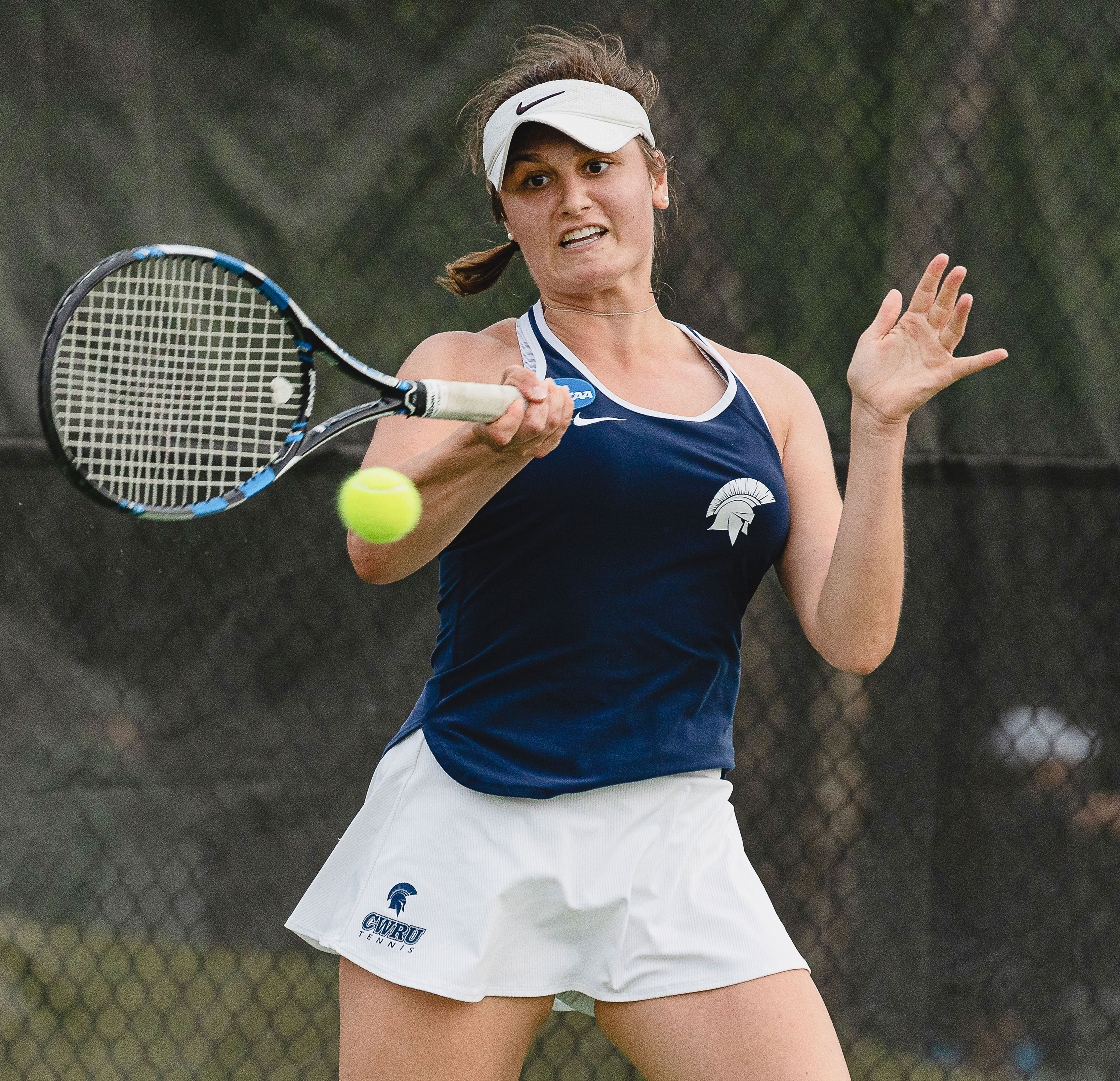 Madeline Paolucci hitting a tennis ball