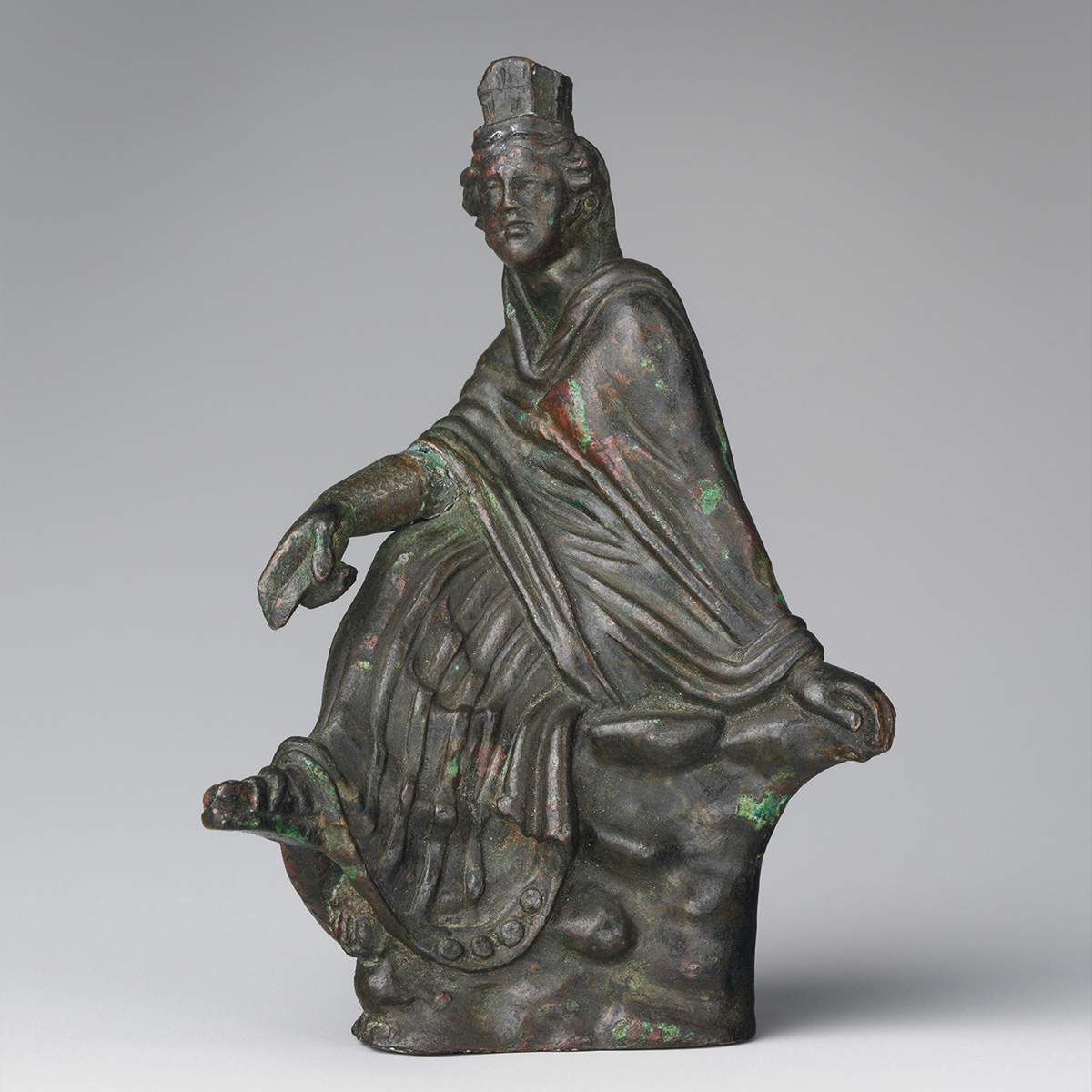 Photo of a miniature bronze replica of a statue from the Greek Hellenistic period.