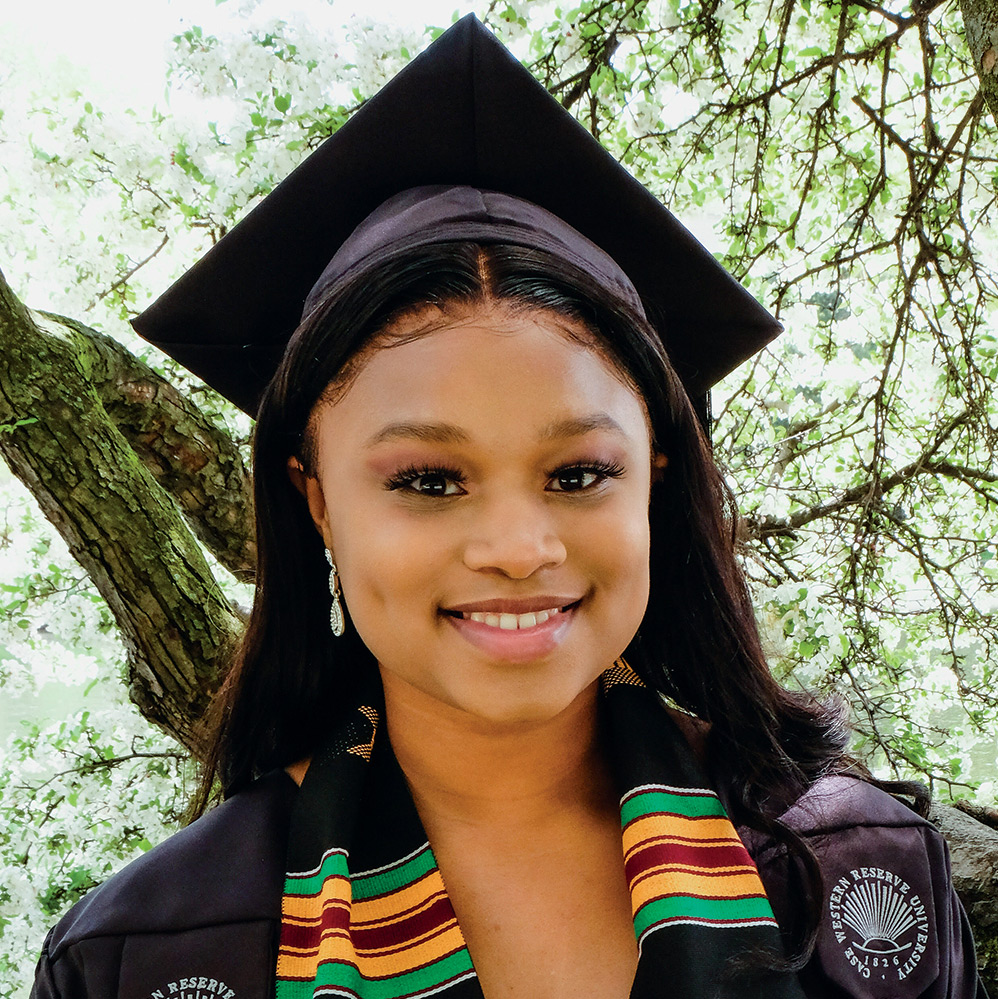 Headshot of Brianna Moore in her cap and gown