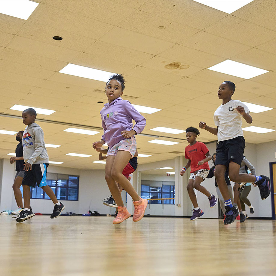 Summer campers practicing a dance routine at Case Western Reserve
