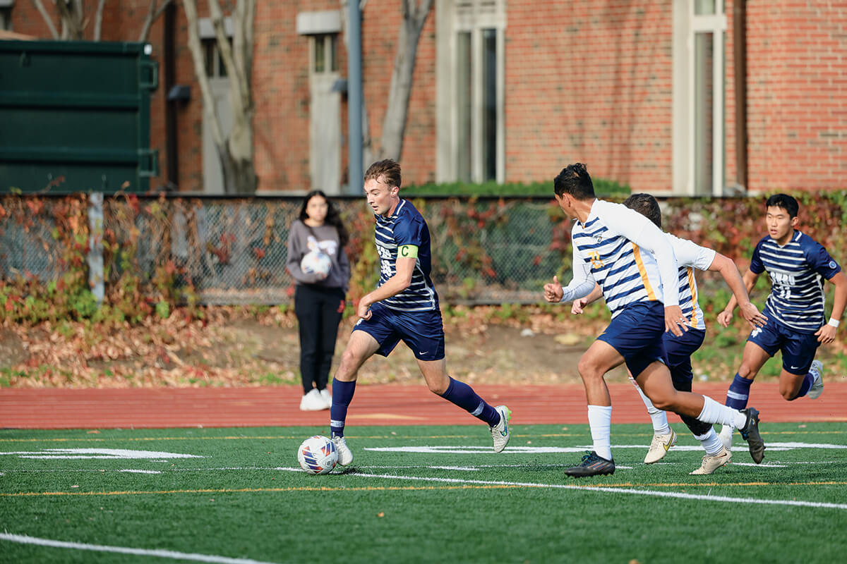 Photo of a men's soccer game in action.