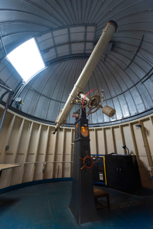 A telescope in a dome room
