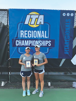 Two Case Western Reserve women's tennis players, Jessica Liu and Madeleine Paolucci, hold championship award plaques 