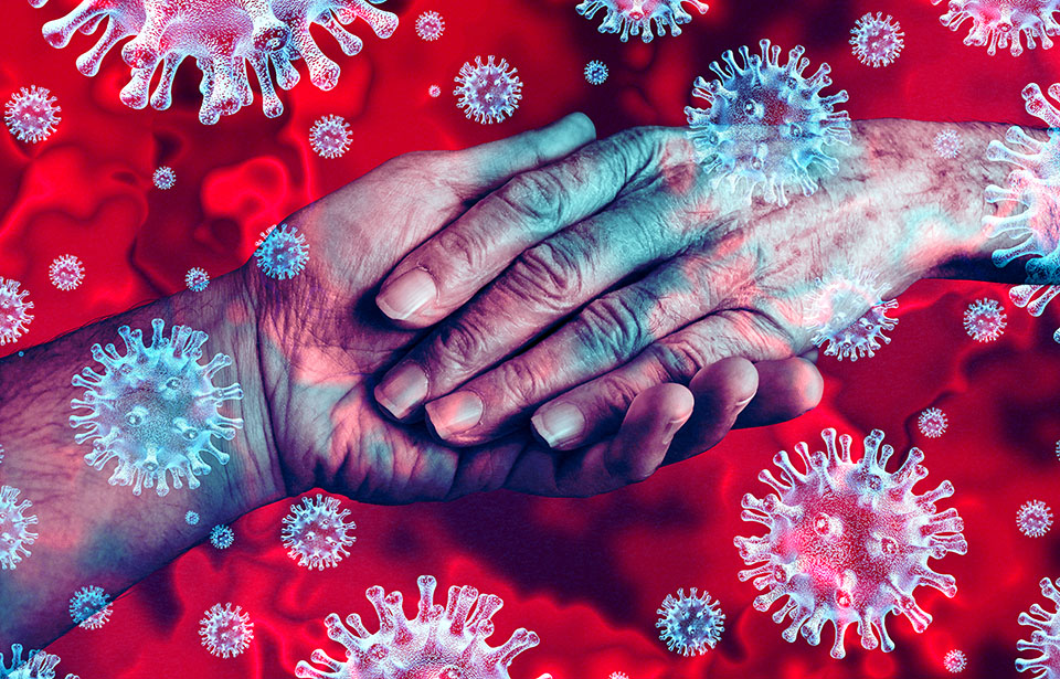 Image of a hand holding another hand with COVID-19 viruses surrounding them