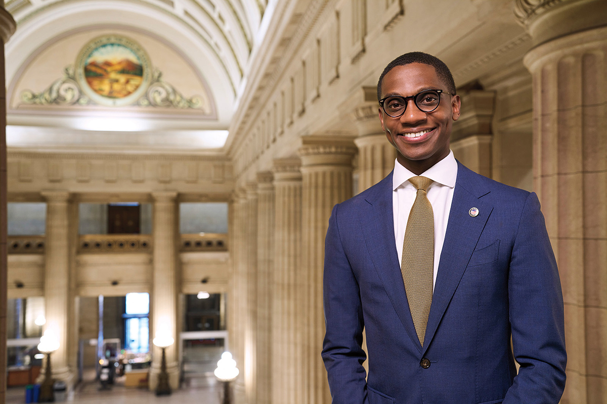 Justin Bibb standing in Cleveland City Hall amid the columns