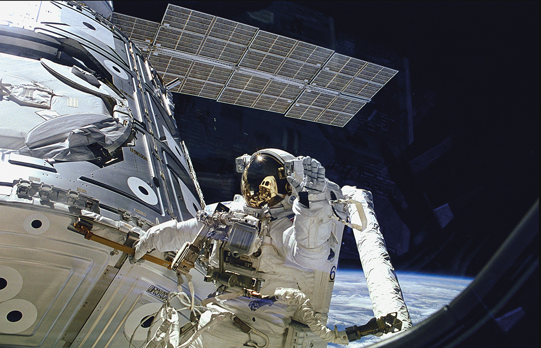 An astronaut working on the exterior of a space station.