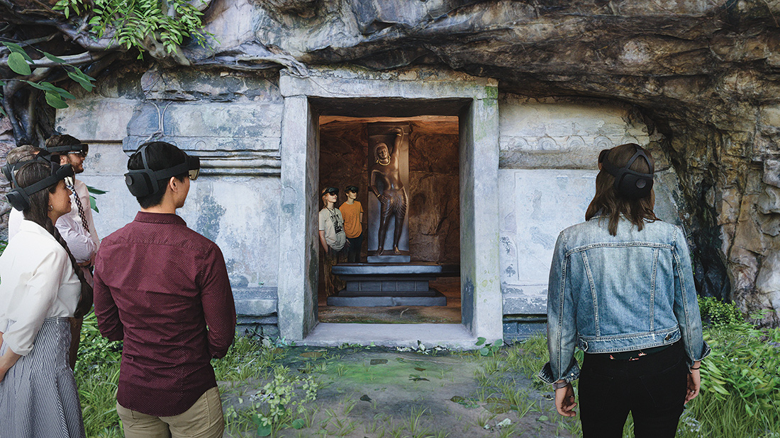 A group of people wearing headsets while looking into a holographically-rendered cave.