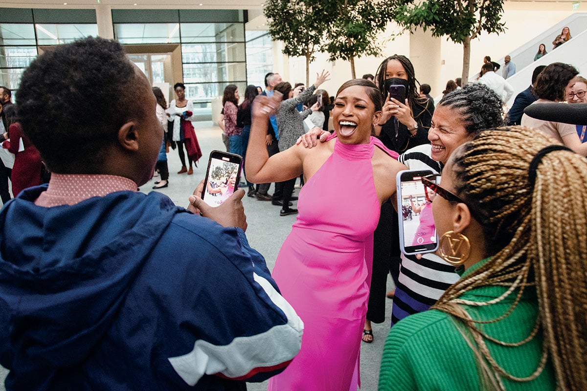 Tamia Potter celebrating and surrounded by people