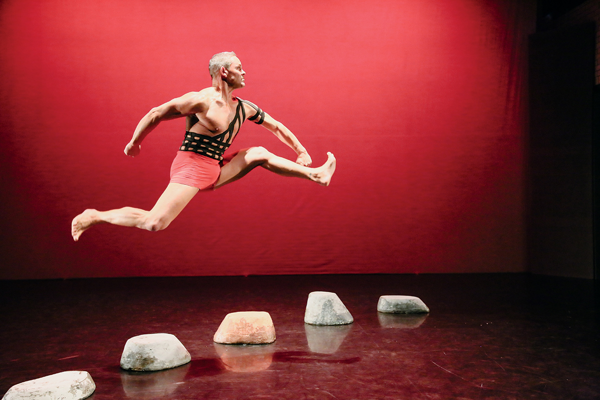 Photo of a dancer leaping high in the air