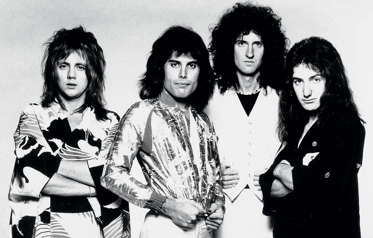 A black and white photo of band members from Queen.