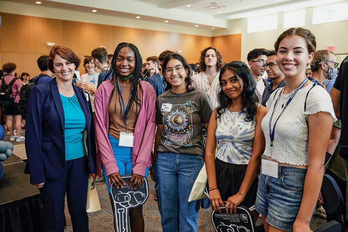 A group of student with Joy Ward at a welcoming event