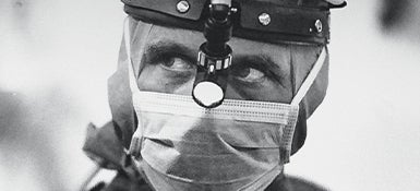 A black and white close-up of Craig Smith ready to operate.