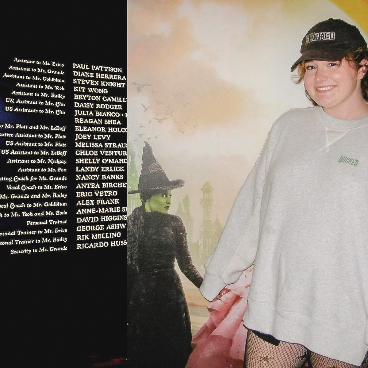 Photo of Julia Bianco standing in front of the Wicked production credits, which include her name.
