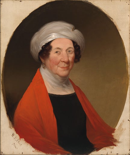 Portrait of a woman in a black shirt, red sweater, and head covering