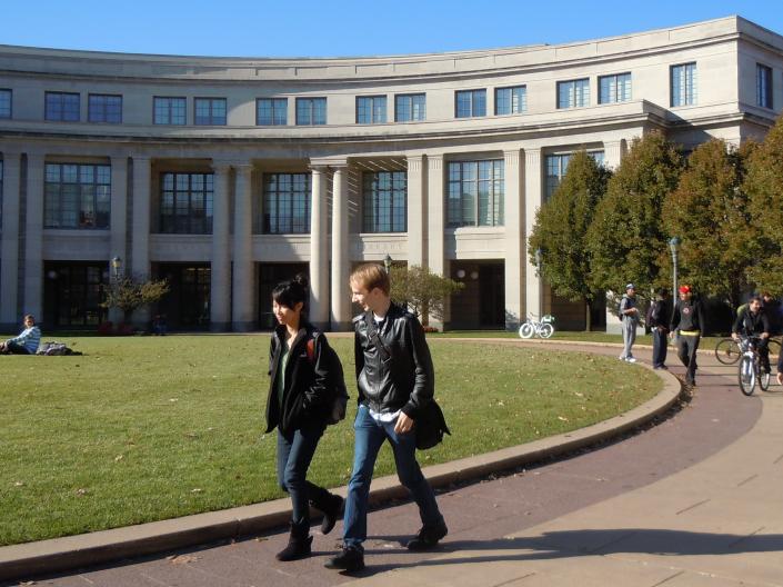 Students walk in front of the Kelvin Smith Library.