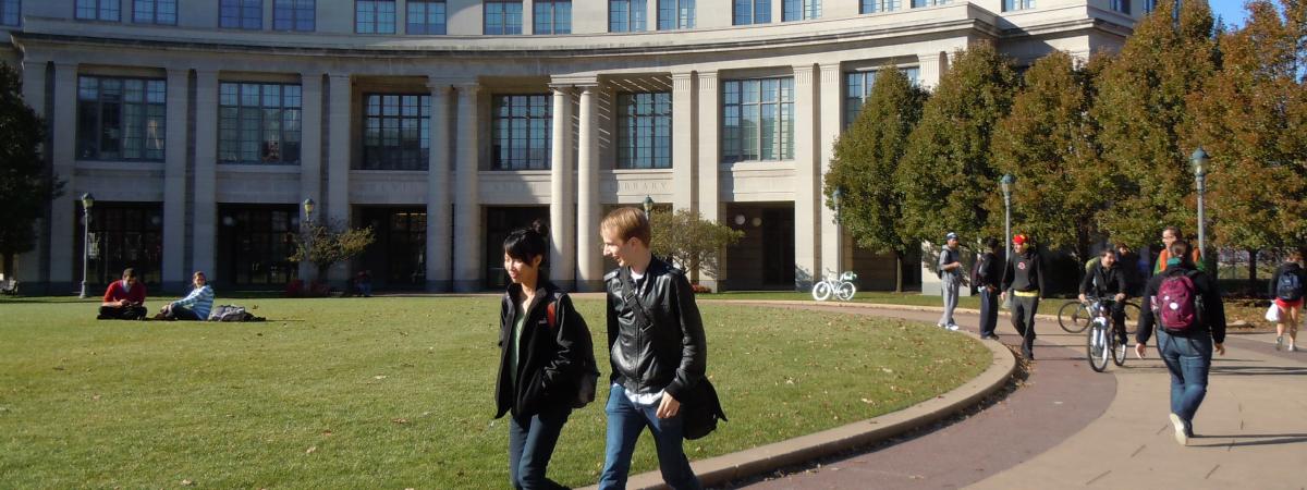 Students walk in front of the Kelvin Smith Library.