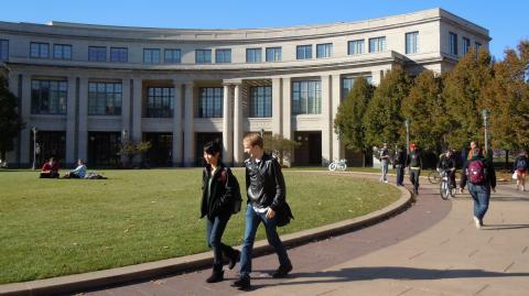 Students walk in front of the Kelvin Smith Library.