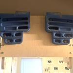 A prototype hangboard affixed to a doorway.