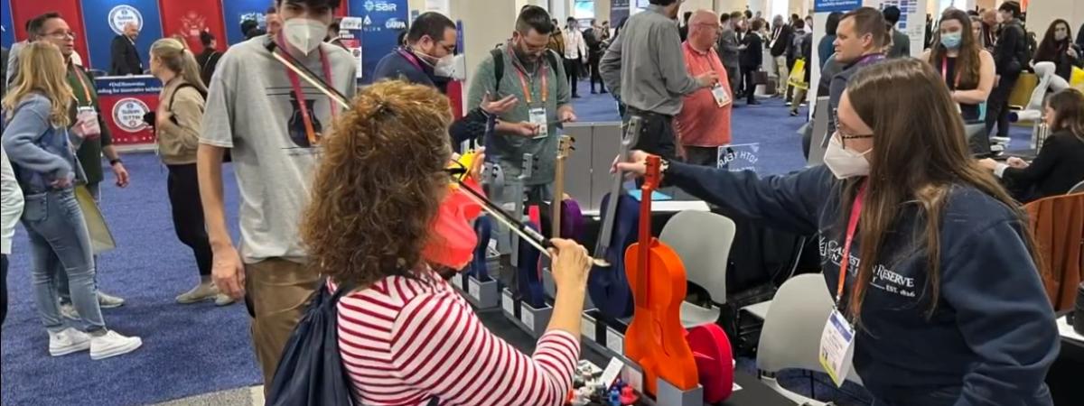 3D Music demonstrates their 3D printed violins at their CES 2023 booth