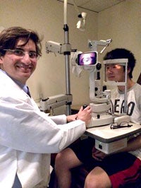 Image of optometrist examining a patient 