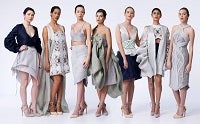 Row of women wearing dresses