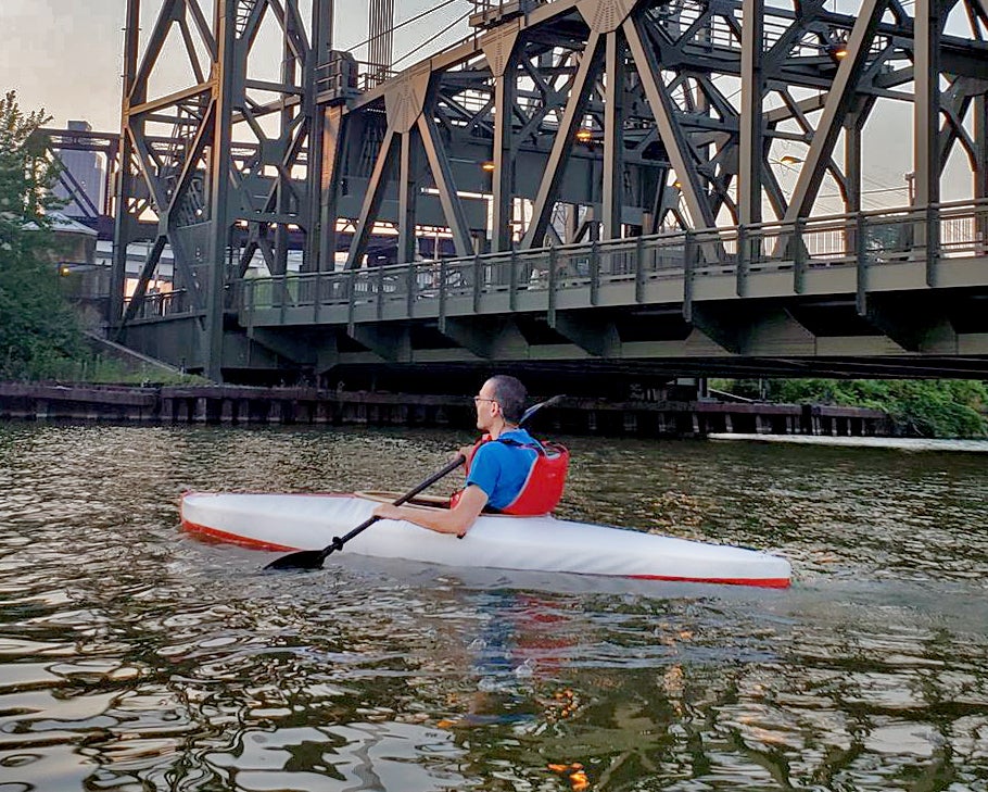 A person kayaking in a prototype made at the think[box]