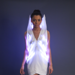 Image of a woman wearing a glowing dress 