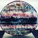 An artwork made of glass that's pink and blue