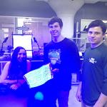 Three students in front of their light therapy device