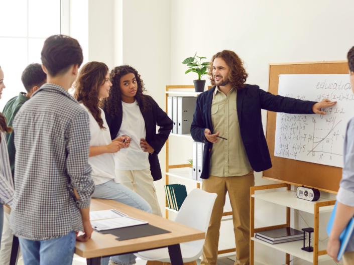 Teacher pointing at whiteboard