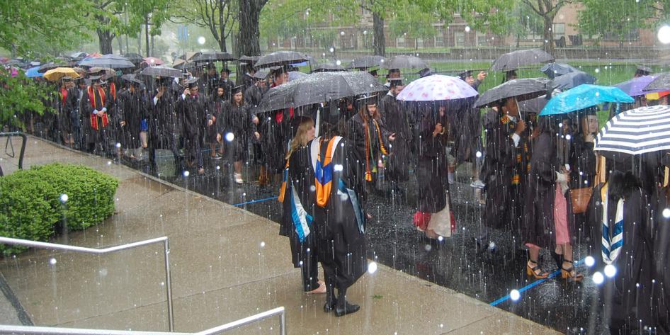 Case Western Reserve University Commencement 2016 graduating students walking on quad in snow