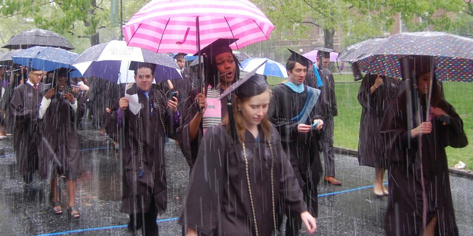 Case Western Reserve University Commencement 2016 graduating students with striped and polka dot umbrellas in snow
