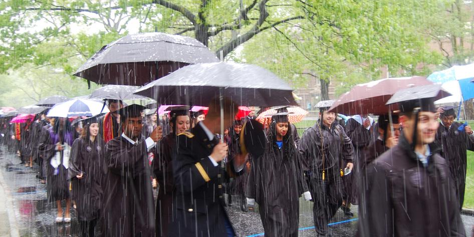 Case Western Reserve University Commencement 2016 graduating students walking in snow and man in military uniform