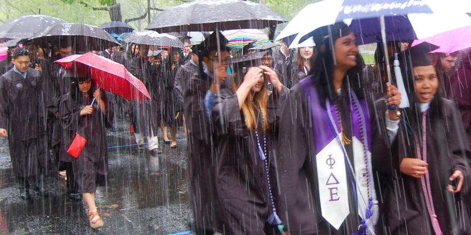 Case Western Reserve University Commencement 2016 graduating students walking with umbrellas phi delta epsilon
