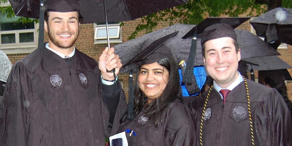 Case Western Reserve University Commencement 2016 three graduating students with umbrella
