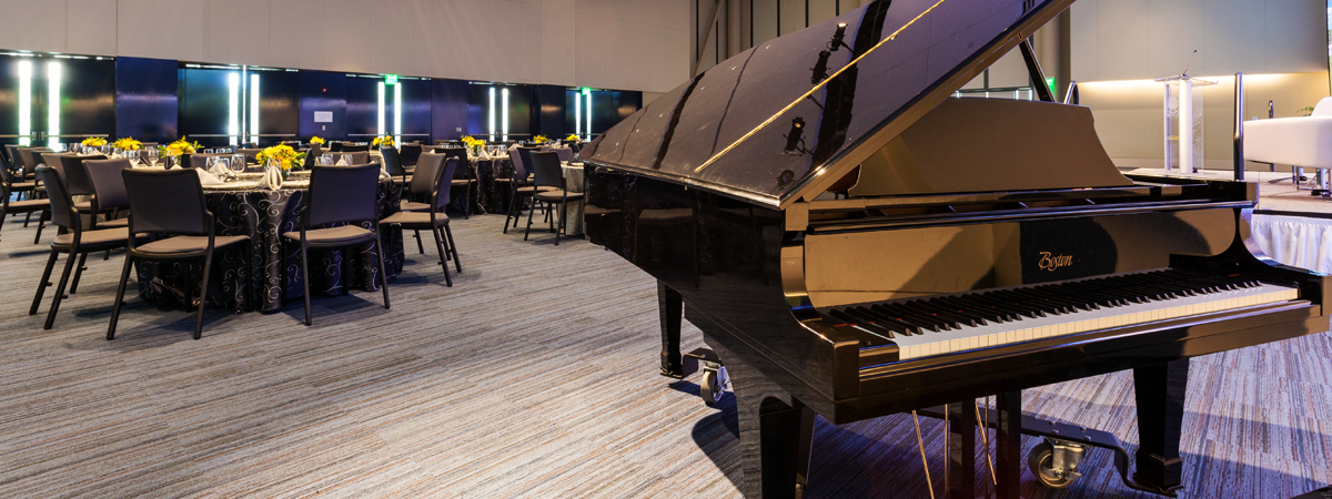 image of piano in ballroom