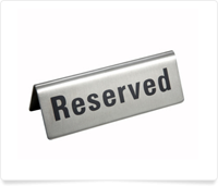 table sign saying reserved