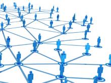 Standing blue pastic looking figures joined by a network of blue lines
