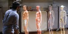man using hololens to look at the human body