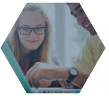 Students reviewing items on a laptop