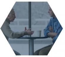 2 men discussing business at a table