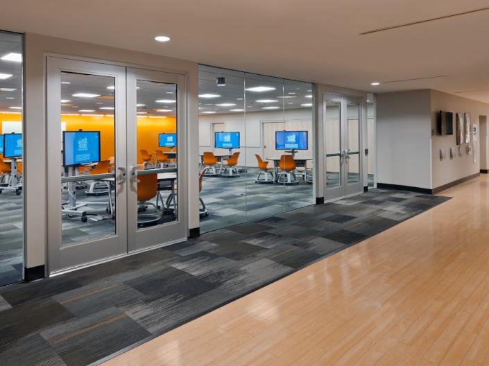 Room filled with Active Learning Terminals from outside a glass wall